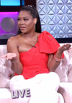 Kenya Moore's red one shoulder bow top on The Real