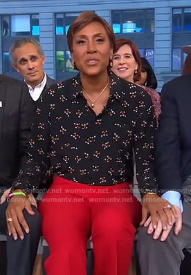 Robin's black mickey mouse print blouse and red pants on Good Morning America