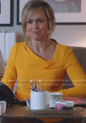 Jacqueline's yellow asymmetric neck top on The Bold Type