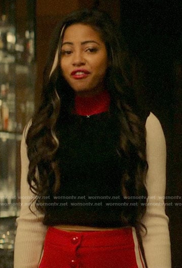 Alexandra's red and black sweater and side striped skirt on Katy Keene
