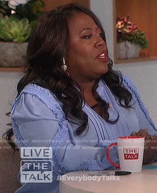 Sheryl's blue ruffle trim blouse on The Talk