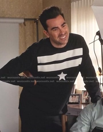 David's black star patch sweater on Schitts Creek