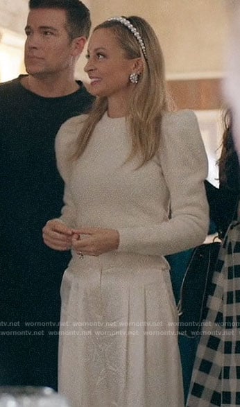 Sierra's white puff sleeve sweater and pleated pants on Bless This Mess