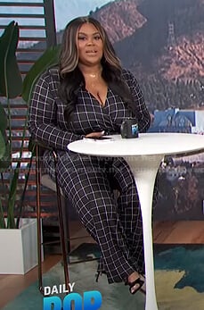 Nina's black grid check jumpsuit on E! News Daily Pop