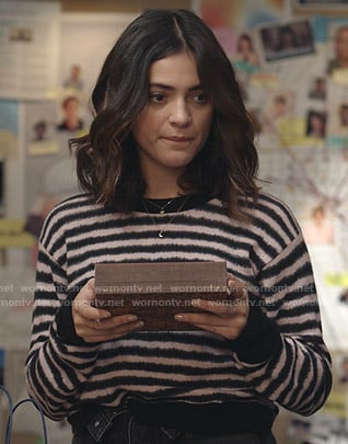 Olive's black and pink striped sweater and denim shorts on Manifest