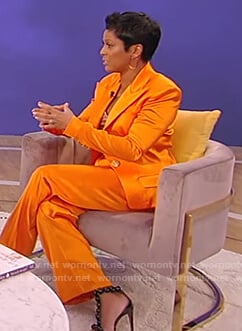 Tamron's orange satin blazer and pants on Tamron Hall Show