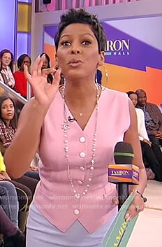 Tamron's pink button vest and blue skirt on Tamron Hall Show
