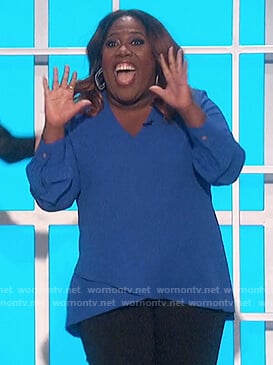 Sheryl's blue v-neck top on The Talk
