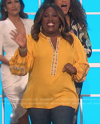 Sheryl's yellow embellished blouse on The Talk