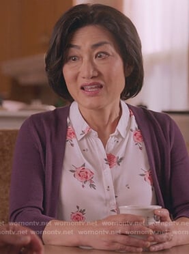 Uma's white rose print sleeveless top on Kims Convenience
