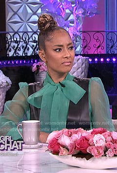 Amanda's green sheer blouse and leather pinafore dress on The Real