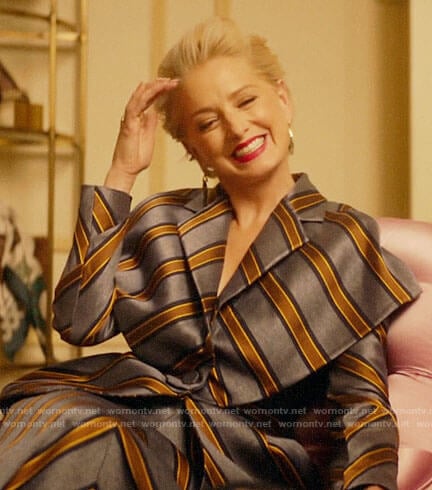 Gloria's blue and gold striped jacket and skirt set on Katy Keene