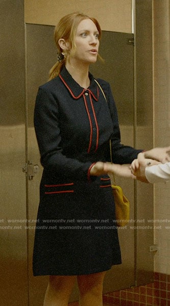 Julia's navy dress with orange trim on Almost Family