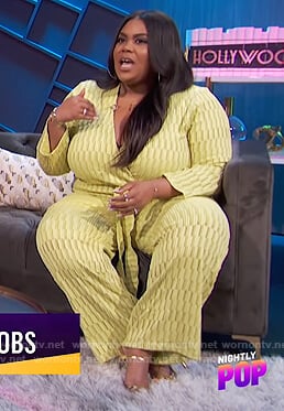 Nina's yellow wrap jumpsuit on E! News Nightly Pop