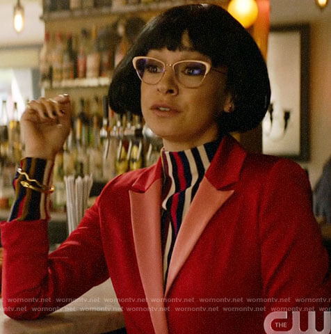 Pepper's striped high neck top and red blazer on Katy Keene