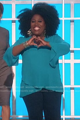 Sheryl's turquoise ruffle hem blouse on The Talk