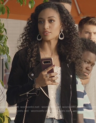 Olivia's white smocked polka dot top and jacket on All American