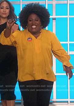 Sheryl's yellow tassel tie blouse on The Talk