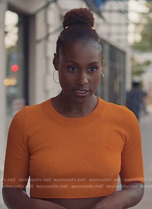 Issa's orange crop top and plaid skirt on Insecure