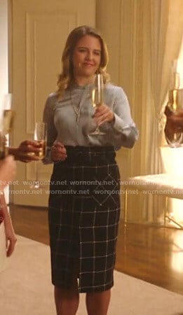 Amanda's blue satin blouse and check skirt on Katy Keene