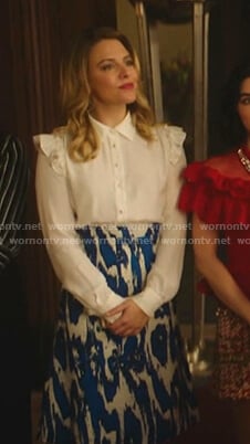 Amanda's white ruffle blouse and printed skirt on Katy Keene