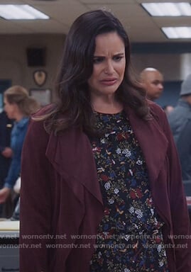Amy's black floral blouse