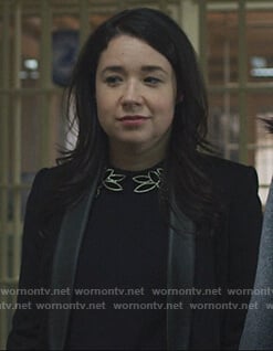 Marissa's black embellished neckline sweater on The Good Fight