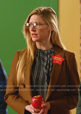 Ava's navy striped asymmetric top on Legends of Tomorrow