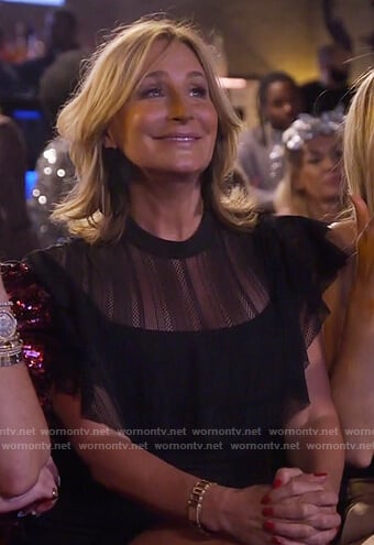 Sonja's black sheer ruffle dress and bow earrings on The Real Housewives of New York City
