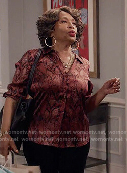 Ruby's red metallic snakeskin blouse on Black-ish