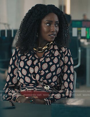Lauren's black printed wrap blouse on Billions