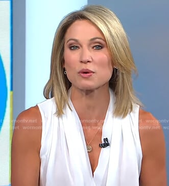 Amy's white sleeveless wrap top and striped pants on Good Morning America
