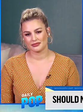 Carissa's mustard dotted wrap top on E! News Daily Pop