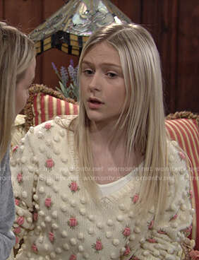 Faith's ivory floral pom pom sweater on The Young and the Restless