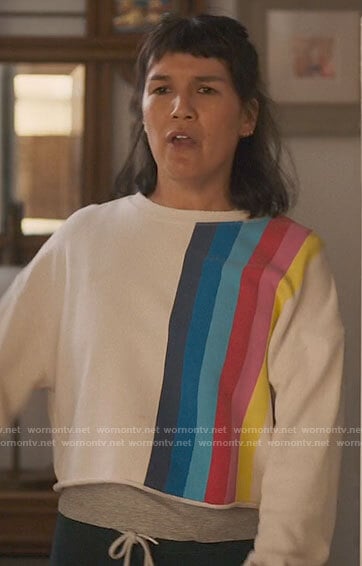 Katie's rainbow striped sweatshirt on The High Note