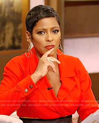 Tamron's red belted jumpsuit on Tamron Hall Show