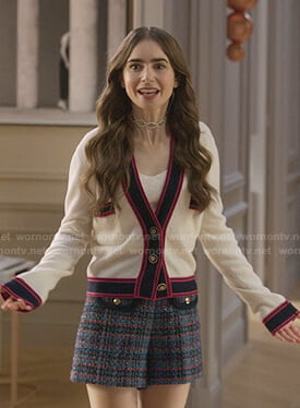 Emily's white contrast cardigan and plaid shorts on Emily in Paris