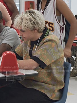 Fraser's floral polo and black backpack on We Are Who We Are