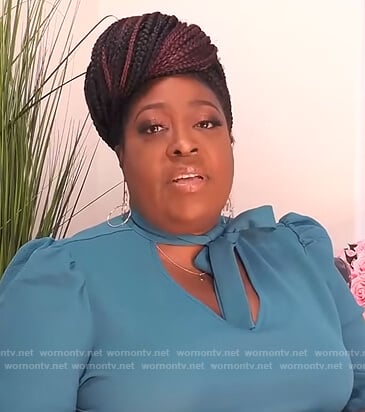 Loni's blue tie neck blouse on The Real