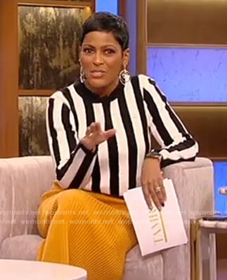 Tamron's striped sweater and orange skirt on Tamron Hall Show