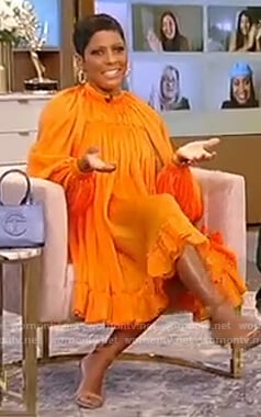 Tamron's orange satin dress on Tamron Hall Show