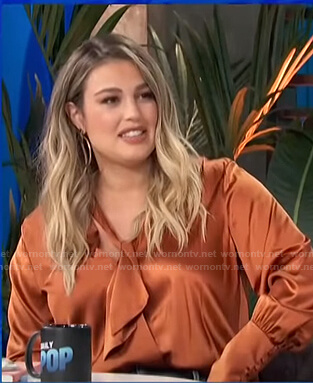 Carissa's orange tie neck satin blouse on E! News Daily Pop