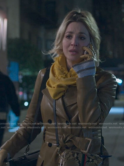Cassie's leather trench coat and yellow scarf on The Flight Attendant