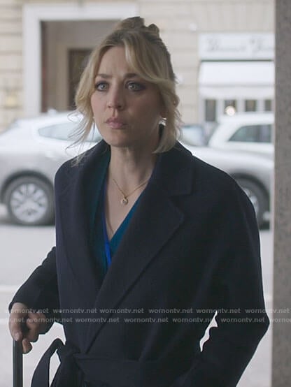 Cassie's long navy wrap coat on The Flight Attendant