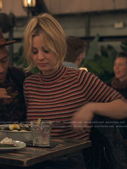 Cassie's striped mock-neck top on The Flight Attendant