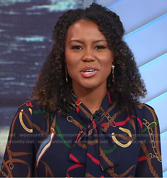 Janai's navy belt print tie neck blouse on Good Morning America