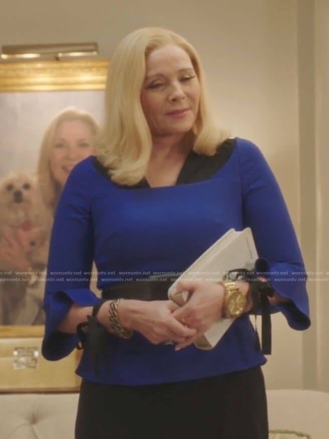 Margaret's blue tie-sleeve top on Filthy Rich