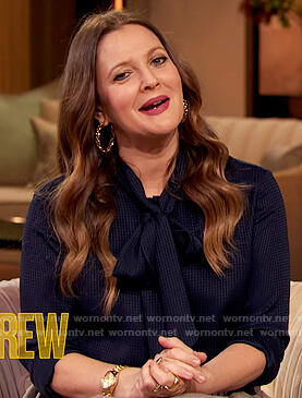 Drew's blue tie neck blouse and pleated skirt on The Drew Barrymore Show