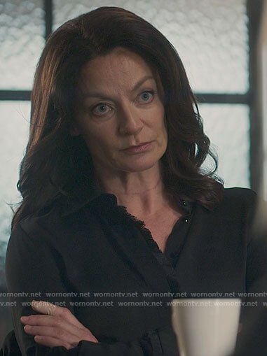 Miranda's black fringe trim blouse on The Flight Attendant