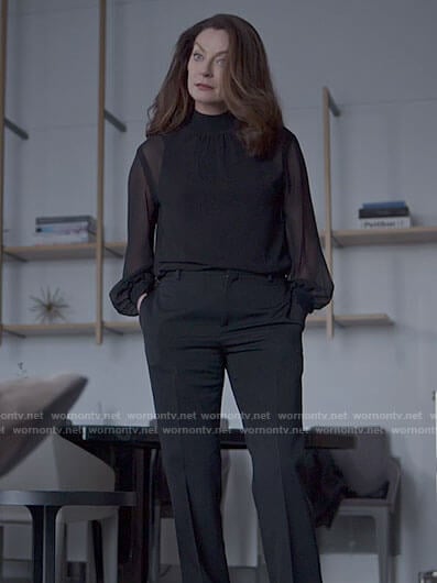 Miranda's black sheer blouse on The Flight Attendant